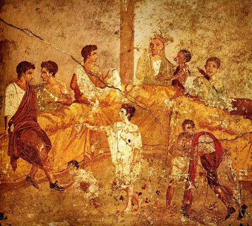 Hostina na nástěnné malbě z Pompeií.